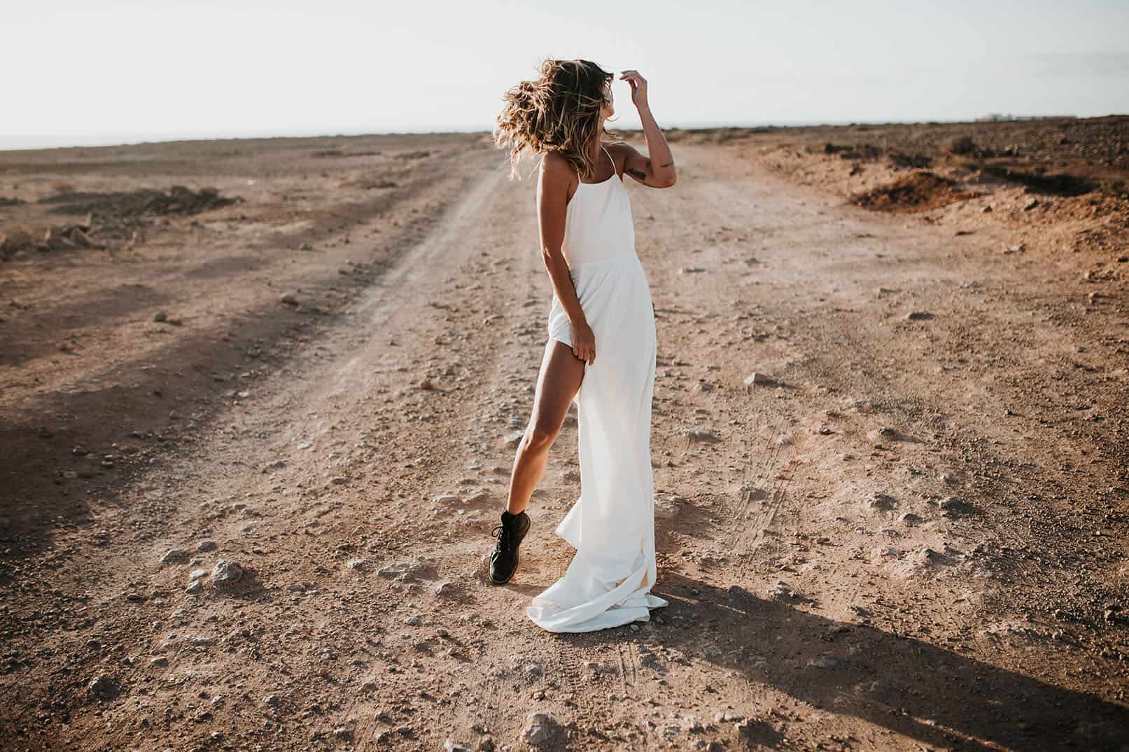 Elopement wedding - bride stood on abandoned road in lanzarote